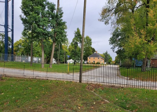 View across Cherry Street fence to 13th Street